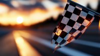 Checkered racing flag waving at sunset with golden light streaming through fabric, creating dramatic silhouette against blurred orange sky background.