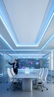 Businesswoman presenting data analytics on futuristic holographic display in modern conference room with blue LED lighting and white furniture.