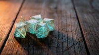 Set of ornate turquoise metal polyhedral dice with intricate engravings on rustic wooden surface for tabletop gaming and role-playing adventures.