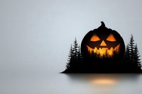 Glowing jack o'lantern silhouette merged with dark forest treeline creates spooky Halloween double exposure effect against misty gray background.