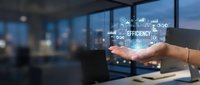 Hand holding glowing digital efficiency concept with icons and charts, symbolizing business productivity and workflow optimization in modern office.