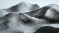 Flowing gray fabric with soft curves and gentle folds creating elegant waves and shadows in monochrome textile composition for luxury fashion and interior design.