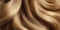 Luxurious blonde hair with golden highlights flowing in smooth waves, showcasing natural shine and silky texture for beauty and haircare concepts.