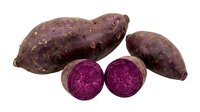 Purple sweet potatoes whole and sliced showing vibrant magenta flesh, isolated on white background for culinary, nutrition, and food design projects.