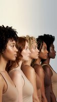 Five diverse women in profile showcasing natural hair textures and skin tones representing beauty inclusivity and multicultural unity in neutral undergarments.