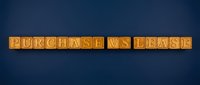 Purchase vs lease comparison displayed on golden tiles against dark blue background for business decision making.