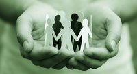 Protective hands cupping paper cutout family figures symbolizing care, support, unity and social protection services for community welfare programs.