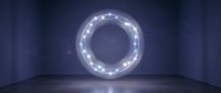 Glowing circular neon light ring with white LED bulbs mounted on dark blue wall in modern interior space for contemporary design and futuristic concepts.