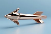Sleek metallic rocket with retro-futuristic design features sharp angular fins and polished chrome finish against soft blue background, concept art for aerospace industry.