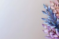 Delicate pink and blue leaves arranged in gradient pattern on light background create soft botanical composition with copy space for text placement.
