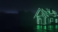 Glowing green neon house outline on dark background representing smart home technology, real estate investment, and modern architecture concepts.