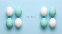 Pastel blue and white Easter eggs arranged symmetrically on a light blue background with Happy Easter text, minimal holiday greeting card.