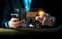 Businessman touching glowing shopping cart icon with e-commerce symbols including payment, delivery and mobile shopping on dark background.