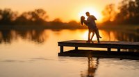 Romantic couple silhouette embracing on wooden dock at golden sunset over calm lake water creating peaceful intimate moment for love and relationship concepts.