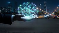 Businessman hand holding glowing digital network connection symbol above city street at night, representing technology innovation and smart urban infrastructure solutions.
