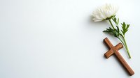 Minimalist composition with wooden cross and white chrysanthemum flower on light background. Religious and memorial concept with copy space.