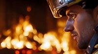 Dramatic side profile of firefighter in helmet against blazing fire background, orange flames creating intense atmospheric lighting and heroic mood.