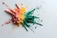 Colorful powder explosion in coral pink, yellow and turquoise green creating dynamic splash pattern on white background. Suitable for cosmetic and art projects.