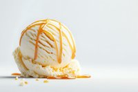 Creamy vanilla ice cream scoop drizzled with golden caramel sauce on white background, soft melting texture creates appetizing dessert presentation.