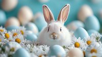 White bunny rabbit surrounded by fresh daisies and pastel blue Easter eggs creating spring holiday composition against blurred turquoise background.