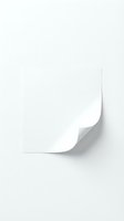 White paper sheet with curled corner and shadow effect on light gray background for business presentations and design projects.