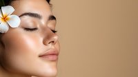 Young Asian woman with plumeria flower in hair, eyes closed, showing natural glowing skin and peaceful expression against neutral beige background. Wellness and beauty concept.