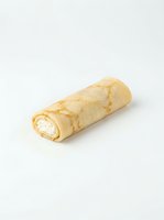 Rolled crepe with white cream filling isolated on white background, ready for food and culinary design projects.