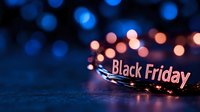 Black Friday sale banner with glowing bokeh lights and festive illumination for holiday shopping promotions and retail marketing campaigns.
