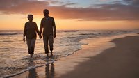 Romantic couple walking hand in hand on beach at sunset with golden sky and ocean waves creating peaceful moment for love and togetherness.