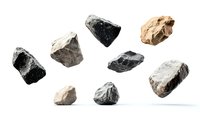 Collection of natural rough stone fragments floating on white background, including granite, basalt and limestone specimens, isolated with shadows.