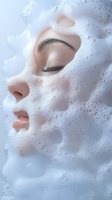 Woman face covered in white foam bubbles for skincare beauty treatment and cleansing routine advertising.