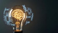 Creative lightbulb with glowing brain filament surrounded by scientific formulas on dark background representing innovation and intelligent solutions.