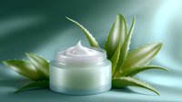 White cosmetic cream jar with fresh aloe vera leaves on green background, natural skincare product for beauty and wellness spa treatments.