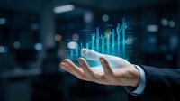 Businessman hand holding glowing blue ascending bar chart with digital data visualization, representing financial growth, market analysis, investment success, and business analytics.
