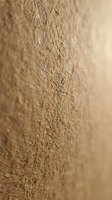 Close-up macro view of natural wood grain texture showing detailed fiber patterns and organic surface structure for interior design projects.