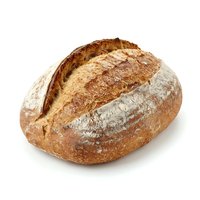 Artisan sourdough loaf with crispy crust and flour dusting, isolated on white background. Suitable for bakery, food, and culinary design projects.