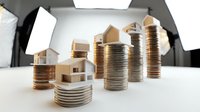 Wooden house models stacked on coins representing property investment, real estate growth, mortgage planning, and financial wealth building for business concepts.