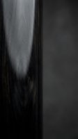 Dark wood grain texture with smooth polished surface and natural patterns for interior design and furniture applications.
