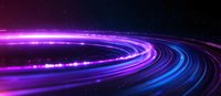 Glowing neon light trails curve through dark space creating dynamic motion effect with vibrant purple and blue streaks against black background.