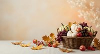 Autumn harvest basket with pumpkins, apples, nuts and colorful fall leaves on rustic table for seasonal decoration and thanksgiving celebration.