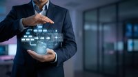 Professional businessman in dark suit protecting digital network icons with hands in modern office environment for technology and cybersecurity concepts.