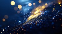 Glowing golden and blue particles with bokeh light effects on dark background create magical atmosphere for festive designs and luxury backgrounds.