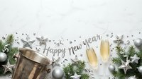 Champagne glasses with silver stars, evergreen branches, and festive decorations on white background for New Year celebrations and holiday party invitations.