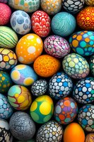 Colorful decorated Easter eggs with modern abstract patterns and geometric designs in vibrant colors. Collection of handcrafted holiday ornaments showing dots, swirls and lines.
