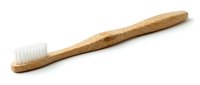 Eco-friendly bamboo toothbrush with natural bristles isolated on white background for sustainable oral hygiene and zero waste lifestyle.