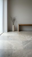 Minimalist interior with natural stone flooring, wooden bench, ceramic vase with dried branches near window. Modern home decor and architectural design concept.
