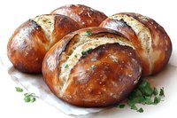 Fresh baked pretzel rolls with golden brown crust, topped with coarse salt and herbs, served on white parchment paper, showing soft interior texture.