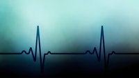 Medical heartbeat rhythm on gradient blue background for healthcare and cardiology presentations.
