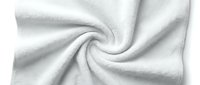 Soft white fabric with gentle folds and flowing texture, suitable for textile, fashion, and design backgrounds.