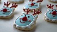 Festive reindeer sugar cookies decorated with blue icing, red nose, and brown antlers create cheerful holiday treats for Christmas celebrations and winter parties.